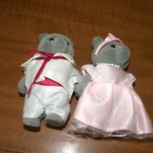 2 little flocked bear figures.